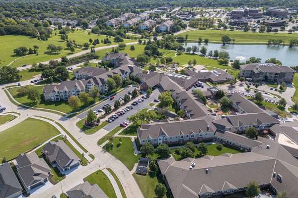 Several residents participate in a Zumba workout on the Patio at Lakeside