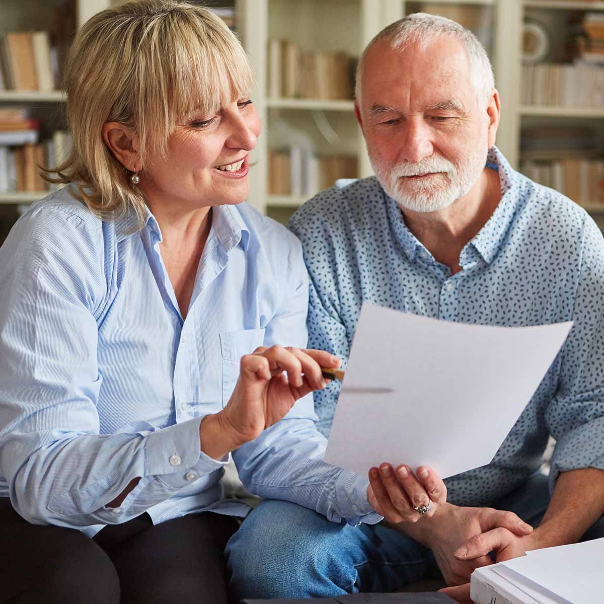 Care navigation specialist consults with a male senior.