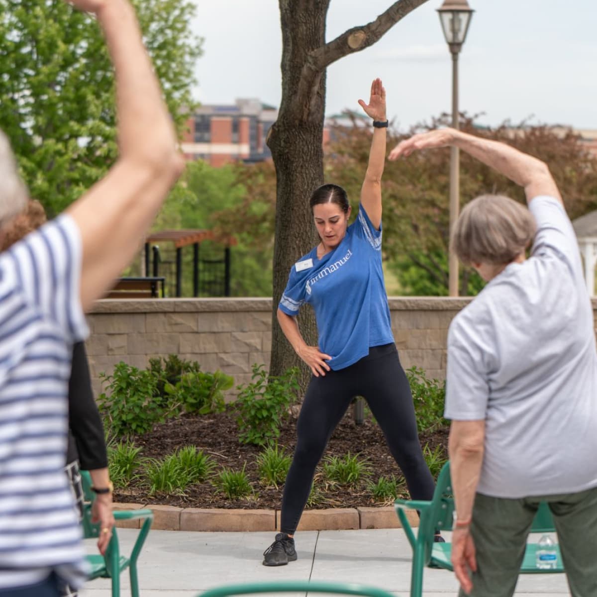 Wellness instructor leading fitness class.