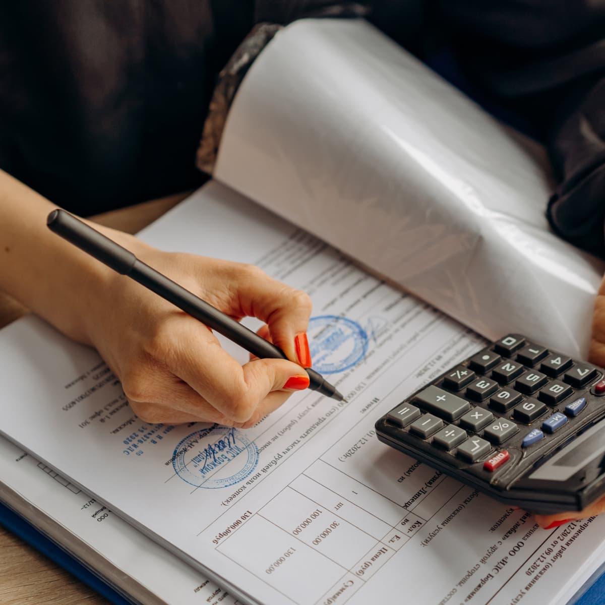 Woman working through calculations.
