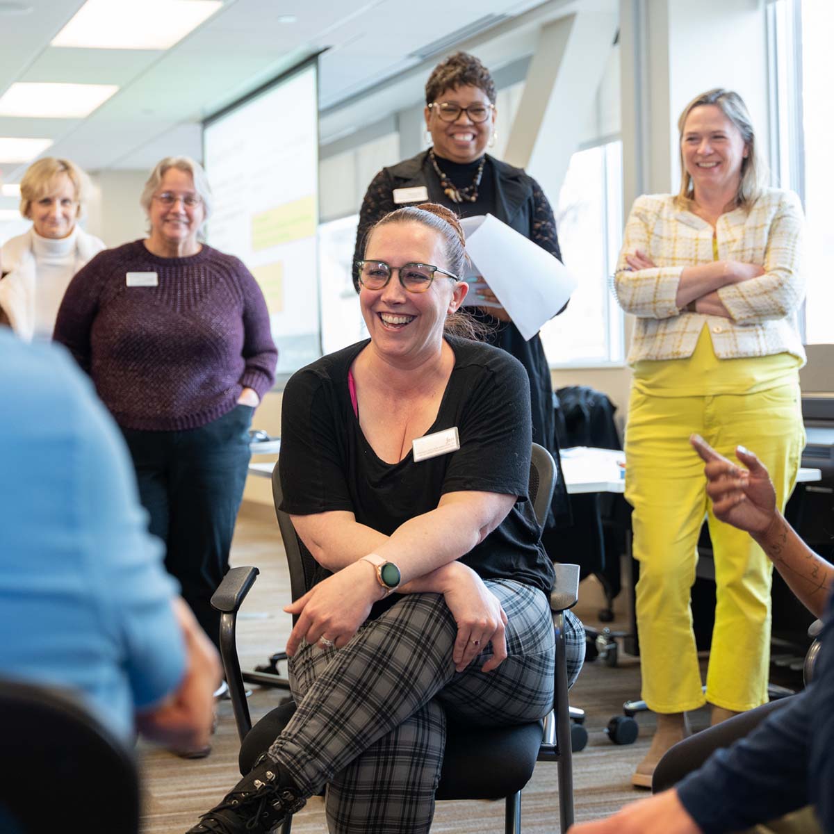 A group of Immanuel employees participate in a group training activity.