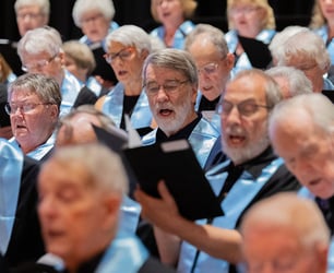 Members of the Immanuel choir perform a musical score.