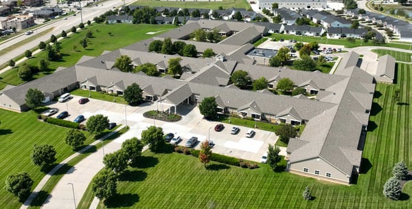 Two residents converse in the front lobby of Yankee Hill Village